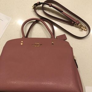 Medium size purse with cross body strap.